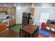 Spacious kitchen combined with a dining area and essential appliances for cooking at 4825 Shea Stadium Ave, Las Vegas, NV 89139