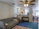 Relaxing living room open to kitchen and dining areas, features modern neutral decor at 4825 Shea Stadium Ave, Las Vegas, NV 89139