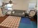 Comfortable living area with a gray sofa, bright window, and ceiling fan at 4825 Shea Stadium Ave, Las Vegas, NV 89139