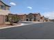 Street view of the neighborhood showing multiple two-story homes and well maintained landscaping at 4825 Shea Stadium Ave, Las Vegas, NV 89139