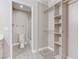 Bathroom featuring a sink, toilet, walk-in shower, and closet space at 4860 Nara Vista Way # 104, Las Vegas, NV 89103