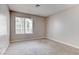 This bedroom features neutral walls, carpet flooring, and a window with blinds at 4860 Nara Vista Way # 104, Las Vegas, NV 89103