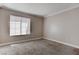Bedroom featuring neutral walls, plush carpet, and a window providing natural light at 4860 Nara Vista Way # 104, Las Vegas, NV 89103