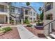 Exterior shot of apartments with walkways and meticulous landscaping at 4860 Nara Vista Way # 104, Las Vegas, NV 89103