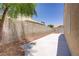 Enclosed backyard with concrete patio, providing a private outdoor space at 5129 Midnight Oil Dr, Las Vegas, NV 89122