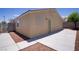 Back exterior of home showcasing a concrete patio and low maintenance yard at 5129 Midnight Oil Dr, Las Vegas, NV 89122