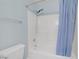 Tiled bathtub with shower featuring modern fixtures and a shower curtain at 5129 Midnight Oil Dr, Las Vegas, NV 89122