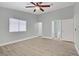 Bright bedroom with a ceiling fan and a view of the en suite bathroom at 5129 Midnight Oil Dr, Las Vegas, NV 89122
