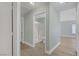 Hallway leads to a modern bathroom and bedroom, with consistent flooring and paint at 5129 Midnight Oil Dr, Las Vegas, NV 89122