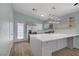 Modern kitchen featuring a stainless steel refrigerator and a large center island at 5129 Midnight Oil Dr, Las Vegas, NV 89122