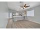 Stylish kitchen with gray cabinets, stainless steel appliances, and a large island at 5129 Midnight Oil Dr, Las Vegas, NV 89122