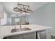 Bright kitchen showcasing island, stainless steel appliances, and granite countertops at 5129 Midnight Oil Dr, Las Vegas, NV 89122