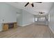 Bright and airy living room open to the kitchen, featuring modern floors and a decorative fireplace at 5129 Midnight Oil Dr, Las Vegas, NV 89122