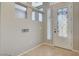 Inviting foyer with decorative glass door, tile flooring, and natural light at 5309 Tartan Hill Ave, Las Vegas, NV 89141