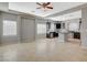 Open-concept living room and kitchen feature tile flooring and recessed lighting at 5309 Tartan Hill Ave, Las Vegas, NV 89141