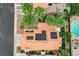 Aerial view of a terracotta tiled roof featuring solar panels and a beautifully landscaped yard with a pool at 5609 Indian Ridge Dr, North Las Vegas, NV 89031