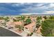 An aerial view showing neighborhood homes with desert landscaping and mountain views at 5609 Indian Ridge Dr, North Las Vegas, NV 89031