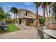 This outdoor area features a gazebo, manicured landscaping, and mature palm trees at 5609 Indian Ridge Dr, North Las Vegas, NV 89031