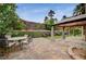 This outdoor living area offers brick pavers and lush landscaping at 5609 Indian Ridge Dr, North Las Vegas, NV 89031