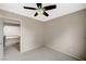 This bedroom has neutral paint and carpet; access to upstairs hallway at 5609 Indian Ridge Dr, North Las Vegas, NV 89031