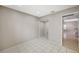 This is a spacious bedroom with light-colored walls and tile floors, perfect for comfortable living and relaxation at 5609 Indian Ridge Dr, North Las Vegas, NV 89031
