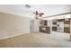 View of the open-concept living room from kitchen featuring tile floors and a breakfast bar at 5609 Indian Ridge Dr, North Las Vegas, NV 89031