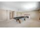 Spacious recreation room with a fireplace and built in shelves offers plenty of room for entertainment and relaxation at 5609 Indian Ridge Dr, North Las Vegas, NV 89031