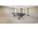 Spacious recreation room with a fireplace and built in shelves offers plenty of room for entertainment and relaxation at 5609 Indian Ridge Dr, North Las Vegas, NV 89031