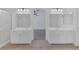 Bright bathroom featuring double vanities, tile floor, and neutral decor for a clean, modern look at 5808 Spinnaker Reach Ave, Las Vegas, NV 89130