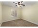 Standard bedroom with carpet, natural light, and ceiling fan at 6779 Rainstorm Ridge Ave, Las Vegas, NV 89131