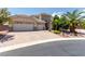 Charming single-story home boasting a three-car garage and a beautifully paved driveway at 6779 Rainstorm Ridge Ave, Las Vegas, NV 89131