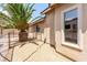 Side view of the house showing RV parking area with privacy fence and low maintenance rock landscaping at 6779 Rainstorm Ridge Ave, Las Vegas, NV 89131