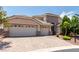 Charming single-story home boasting a three-car garage and a beautifully paved driveway at 6779 Rainstorm Ridge Ave, Las Vegas, NV 89131