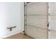 Close up of the inside of a garage, showcasing the garage door mechanism and utility access at 6779 Rainstorm Ridge Ave, Las Vegas, NV 89131
