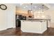Well-equipped kitchen with granite countertops and black appliances at 6779 Rainstorm Ridge Ave, Las Vegas, NV 89131