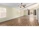 Bright living room with wood floors, ceiling fans, and natural light at 6779 Rainstorm Ridge Ave, Las Vegas, NV 89131