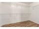 Walk-in closet features laminated wood flooring and wire rack shelving at 6779 Rainstorm Ridge Ave, Las Vegas, NV 89131