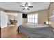 Comfortable bedroom featuring natural light, ceiling fan, and stone-accented wall at 6800 E Lake Mead Blvd # 2089, Las Vegas, NV 89156