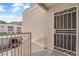Condo entryway with secure gate, complemented by scenic mountain views at 6800 E Lake Mead Blvd # 2089, Las Vegas, NV 89156