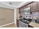 Modern kitchen featuring stainless steel appliances, tiled backsplash, and ample counter space at 6800 E Lake Mead Blvd # 2089, Las Vegas, NV 89156