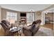 Cozy living room features a fireplace, comfortable seating, and ample natural light from shuttered windows at 6800 E Lake Mead Blvd # 2089, Las Vegas, NV 89156