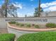 Community signage for Mountain Side Condominiums with cactus and lush foliage at 6800 E Lake Mead Blvd # 2089, Las Vegas, NV 89156