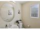 Cute half bathroom with decorative mirror, sink and modern fixtures at 6807 Satin Silver Ct, North Las Vegas, NV 89086