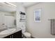Bright bathroom with granite counters, modern fixtures, and ample storage at 6807 Satin Silver Ct, North Las Vegas, NV 89086