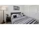 Comfortable bedroom showcasing neutral tones, a plush bed, and a classic car print on the wall at 6807 Satin Silver Ct, North Las Vegas, NV 89086