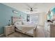 Bright bedroom features a ceiling fan, sliding glass door, and elegant neutral decor at 6807 Satin Silver Ct, North Las Vegas, NV 89086