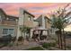 Charming townhome features a cozy patio area with a gazebo, perfect for outdoor dining and relaxation at sunset at 6807 Satin Silver Ct, North Las Vegas, NV 89086