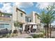 Inviting townhome showcasing a private patio with gazebo, enhancing outdoor living, and manicured landscaping at 6807 Satin Silver Ct, North Las Vegas, NV 89086