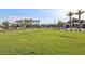 Expansive community green space, perfect for outdoor activities, with palm trees and a cabana at 6807 Satin Silver Ct, North Las Vegas, NV 89086