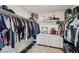 Spacious walk-in closet offering ample storage with shelving, hanging racks, and a dresser at 6807 Satin Silver Ct, North Las Vegas, NV 89086